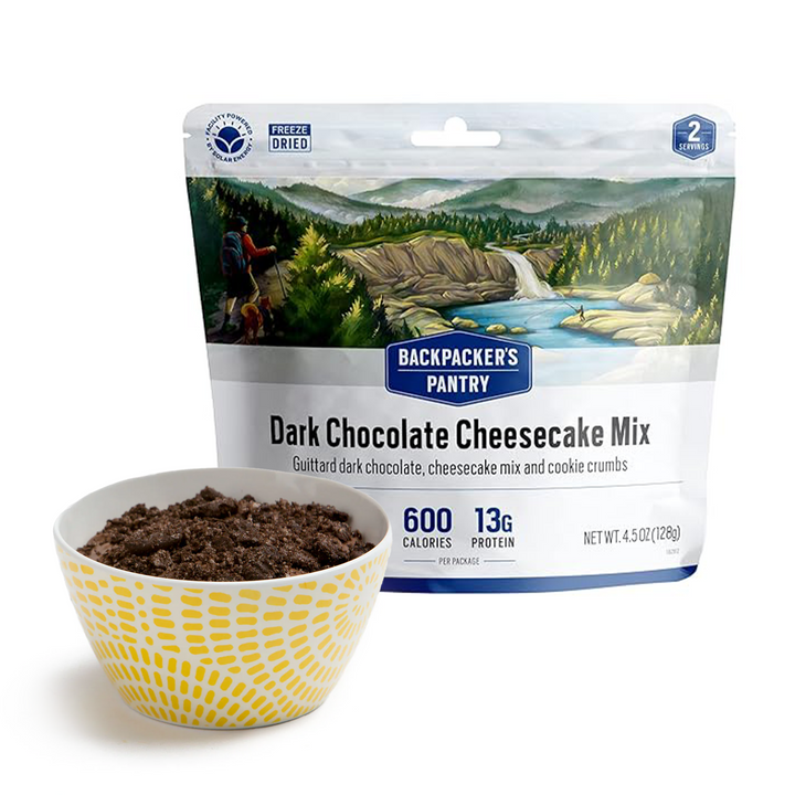Backpackers Pantry Dark Chocolate Cheesecake Mix with prepared dessert in bowl in front of package